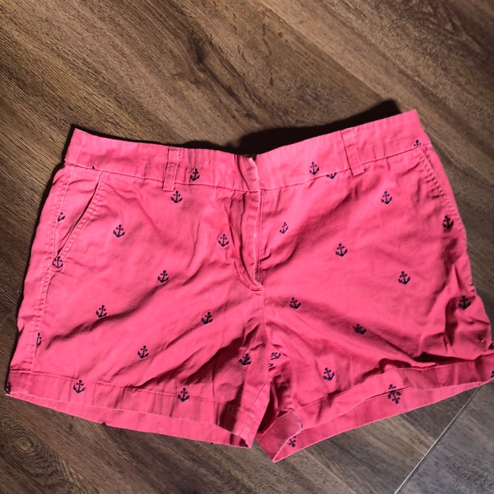 Salmon colored shorts with navy anchors.